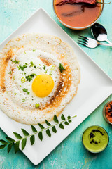 Egg Dosa is a popular south indian non-vegetarian breakfast or meal, served with sambar and chutney