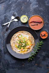 Egg Dosa is a popular south indian non-vegetarian breakfast or meal, served with sambar and chutney