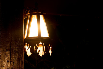 Fototapeta na wymiar The lamp shines in the dark night.