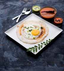 Egg Dosa is a popular south indian non-vegetarian breakfast or meal, served with sambar and chutney