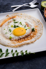 Egg Dosa is a popular south indian non-vegetarian breakfast or meal, served with sambar and chutney