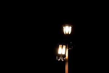 The lamp shines in the dark night.