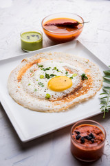 Egg Dosa is a popular south indian non-vegetarian breakfast or meal, served with sambar and chutney