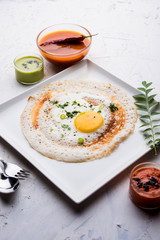 Egg Dosa is a popular south indian non-vegetarian breakfast or meal, served with sambar and chutney