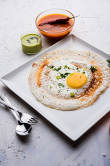 Egg Dosa is a popular south indian non-vegetarian breakfast or meal, served with sambar and chutney