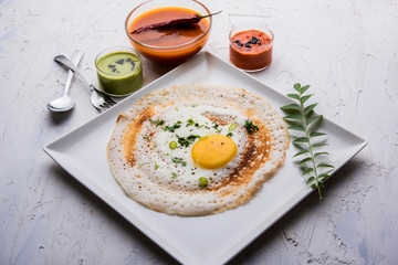 Egg Dosa is a popular south indian non-vegetarian breakfast or meal, served with sambar and chutney