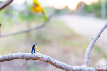Miniature people : worker are cutting The branches , Deforestation concept. 