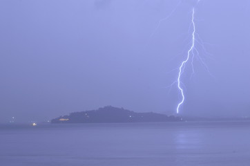 Lightning strike over island