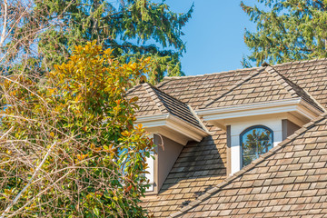 The top of the house or apartment building with nice window.