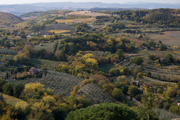 Fototapeta na wymiar Countryside landscape. Countryside landscape with hills and a homestead; typical landscape of central Italy