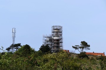 Lighthouse Vlieland, Netherlands, surrounded by scaffolding for renovation