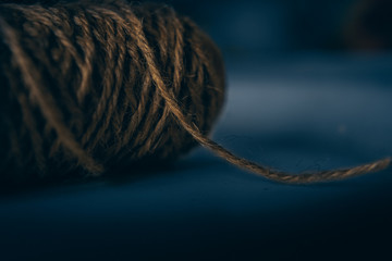 Jute string roll close up on blue background