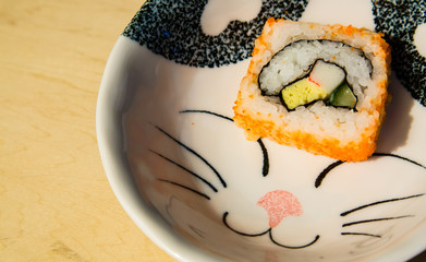 sushi in a cute cat plate closeup view