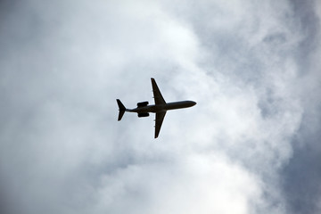 The airplane flies in the clouds.The plane flies in the clouds. bird`s eye view