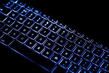 Blue light colour black keyboard with copy space