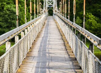 Obraz premium View of the pedestrian bridge through the Neman River in the city Mosty, Republic of Belarus
