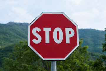 Stop and give precedence. Stop road sign.