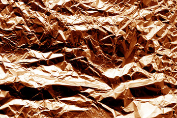 Metal foil texture in orange color.
