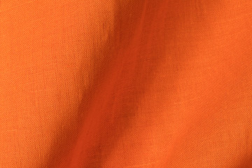 Patchwork detail of orange linen fabric