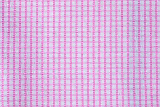 The texture of the tablecloth of pink pictures on the table in the snack.