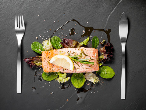 Grilled Salmon Fillet With Salad On Black