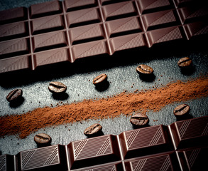 Black chocolate bar, coffee beans, cocoa powder