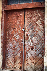 Old entrance wooden doors in the old house.
