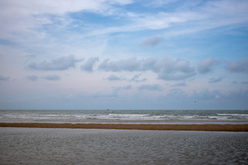 Blue sky beach sea and sand.