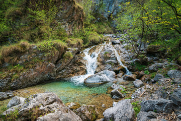 Awesome view of the Vertova torrent at sunset, in the middle of the Orobiche mountains with its beautiful tiny waterfalls.