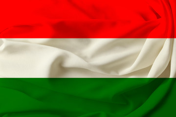 Obraz premium beautiful flag of Hungary on pleated fabric