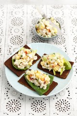 Pumpernickel with chicken, cucumber, nectarine and almond salad