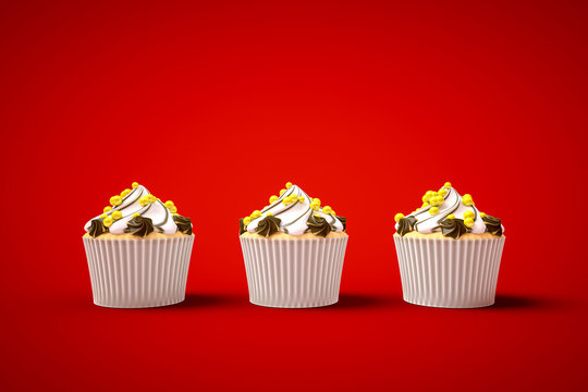 three cupcakes on red background