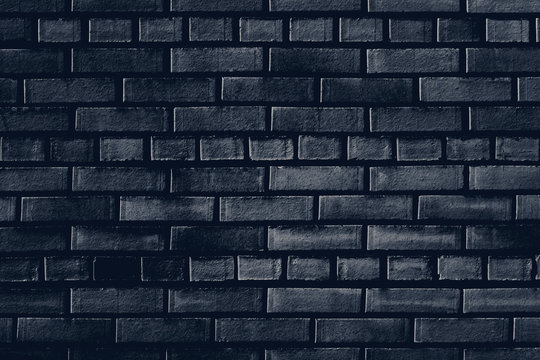 Old dark blue brick wall texture for background
