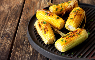 Grilled sweet corn with smoked paprika, salt and cilantro.Summer vegan dinner or snack