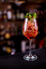 Fresh summer lemonade with berries on the bar table