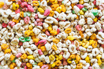 Bright color crunchy cereals with delicious fruit flavor – Background of heathy and nutritious breakfast full of vitamins and source of fiber