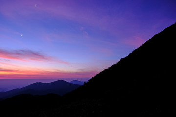 Twilight light pink and purple colors beautifully. reflect the views Mountains and fog in the morning. Khao Jed Yod, Trang in Thailand.