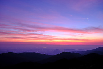 Fototapeta premium Twilight light pink and purple colors beautifully. reflect the views Mountains and fog in the morning. Khao Jed Yod, Trang in Thailand.