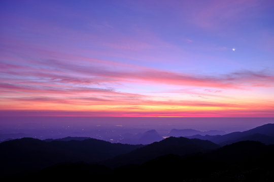 Twilight light pink and purple colors beautifully. reflect the views Mountains and fog in the morning. Khao Jed Yod, Trang in Thailand.