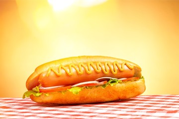 Barbecue Grilled Hot Dog with Yellow Mustard on  background