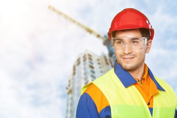 Portrait of happy young foreman with hard hat