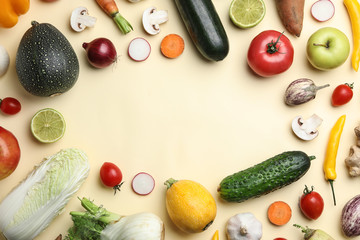 Flat lay composition with fresh vegetables and fruits on color background. Space for text © New Africa