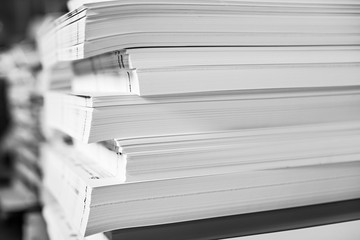 A huge pile of paper in the printing house. Printing industry texture Background