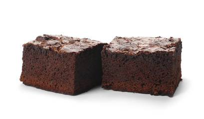 Pieces of fresh brownie on white background. Delicious chocolate pie