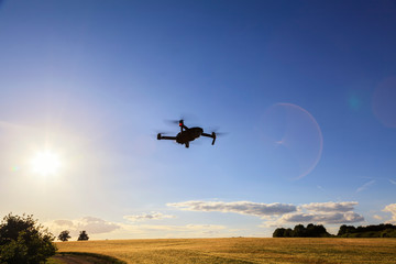 Fototapeta na wymiar Flying drone above the wheat field