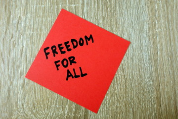 Text freedom for all written on red sticker