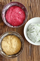 Different pizza dough: with beetroot juice, with spinach, wholemeal flour with carrot juice