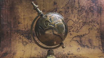 Fototapeta na wymiar World Globe Model With Pedestal Stand