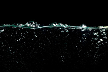 air bubbles water splash isolated on black background
