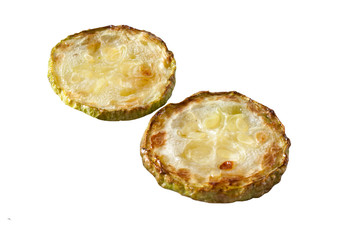 Fried several zucchini on a white background close-up.